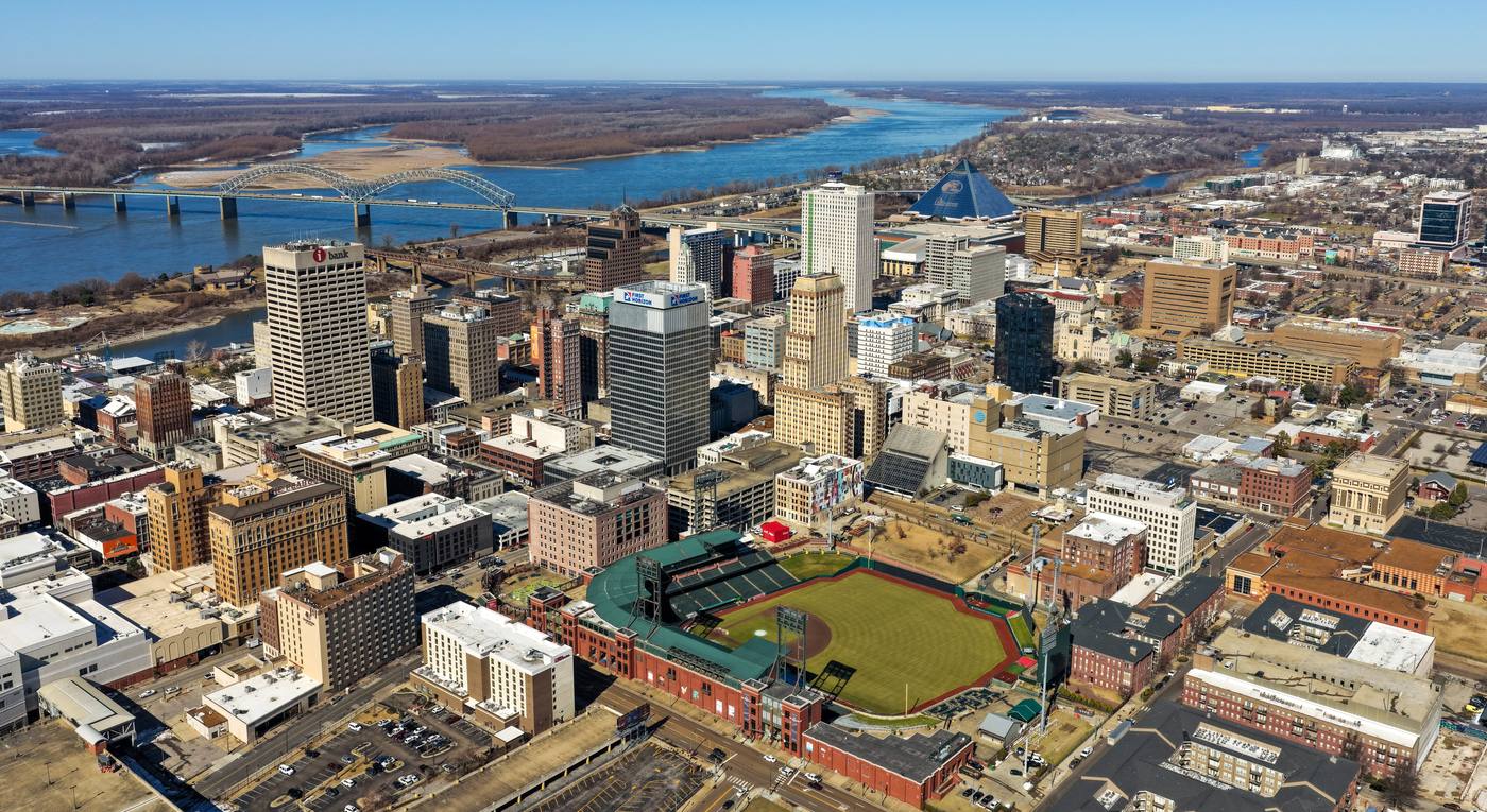 Aerial view of downtown Memphis with AutoZone Park, the Hernando de Soto Bridge, the Pyramid, and the Mississippi River